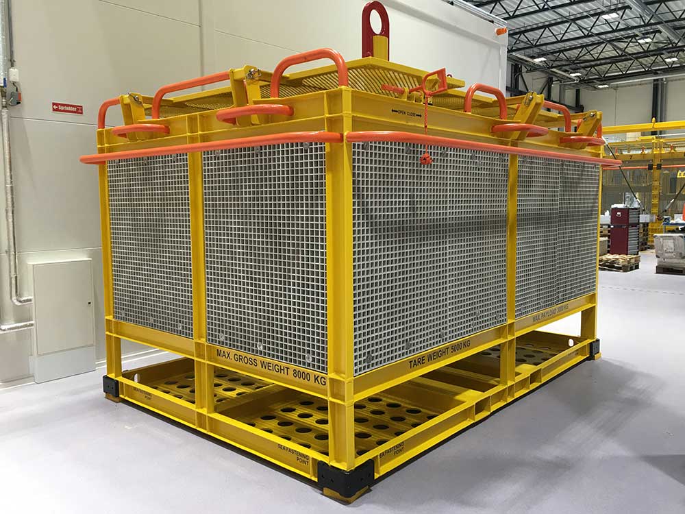 Tool storage and transportation basket to transport and store equipment subsea standing on the floor in Depro's workshop hall.